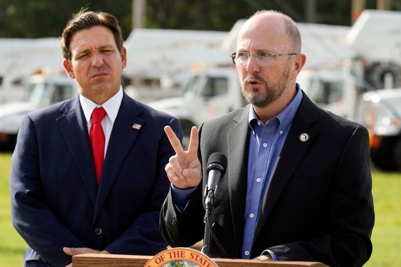 Kevin Guthrie, Director of Florida Division of Emergency Management, right, gestures as Gov. Ron DeSantis looks on during a news conference, Wednesday, Sept. 25, 2024, at the Tampa Electric Company offices in Tampa, Fla., as Tropical Storm Helene, expected to become a hurricane, moves north along Mexico’s coast toward the U.S. (AP Photo/Chris O'Meara)