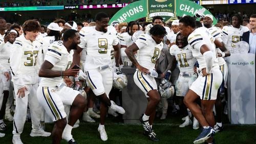 Georgia Tech players celebrate after the NCAA college football game between Georgia Tech and Florida State at the Aviva stadium in Dublin, Saturday, Aug. 24, 2024. (AP Photo/Peter Morrison)