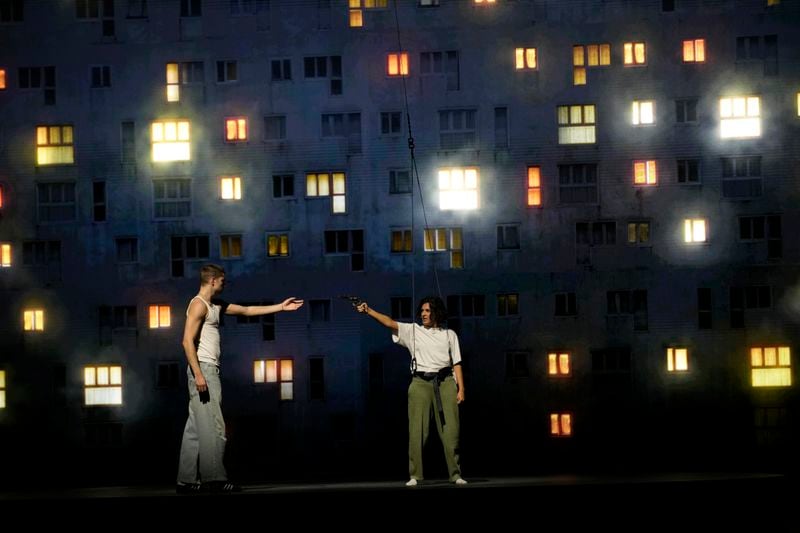 Actors perform during a rehearsal of La Haine musical show, in Tremblay en France, Tuesday, Sept. 17, 2024. (AP Photo/Christophe Ena)