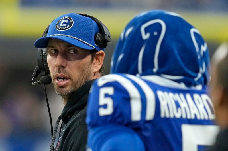 Indianapolis Colts quarterback Anthony Richardson (5) stands on the sideline next to head coach Shane Steichen, left, after being injured during the first half of an NFL football game against the Pittsburgh Steelers, Sunday, Sept. 29, 2024, in Indianapolis. (AP Photo/Darron Cummings)