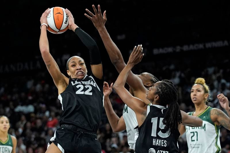 Las Vegas Aces center A'ja Wilson (22) grabs a rebound against the Seattle Storm during the second half in Game 2 of a WNBA basketball first-round playoff game Tuesday, Sept. 24, 2024, in Las Vegas. (AP Photo/John Locher)