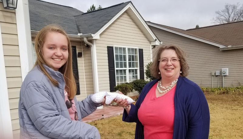 Bryn with nurse Sherry Domah who helped her with the project and will continue to make 'Tiny Hugs' for hospitals that need them. Courtesy of Bryn Hammock.