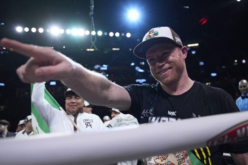 Canelo Alvarez celebrates after defeating Edgar Berlanga in a super middleweight title bout Saturday, Sept. 14, 2024, in Las Vegas. (AP Photo/John Locher)