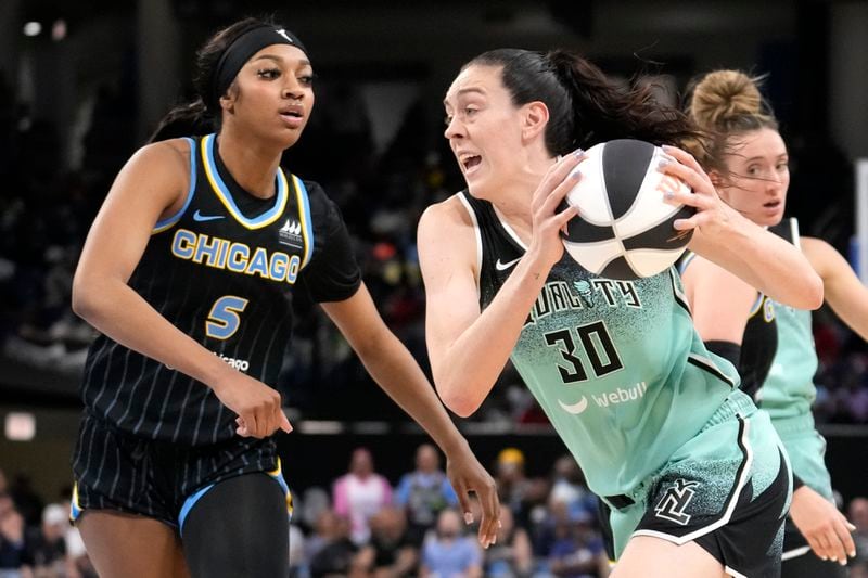 New York Liberty's Breanna Stewart (30) drives to the basket as Chicago Sky's Angel Reese (5) defends during the second half of a WNBA basketball game Tuesday, June 4, 2024, in Chicago. The Liberty won 88-75. (AP Photo/Charles Rex Arbogast)