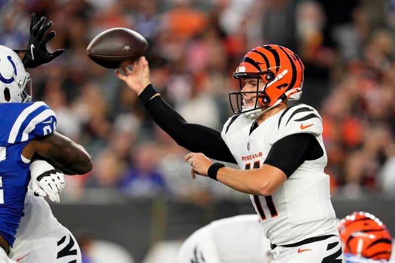 Cincinnati Bengals quarterback Logan Woodside (11) throws a pass during the first half of a preseason NFL football game against the Indianapolis Colts, Thursday, Aug. 22, 2024, in Cincinnati. (AP Photo/Jeff Dean)