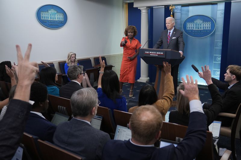 White House press secretary Karine Jean-Pierre calls on a reporter as President Joe Biden makes a surprise appearance to take questions during the daily briefing at the White House in Washington, Friday, Oct. 4, 2024. (AP Photo/Susan Walsh)