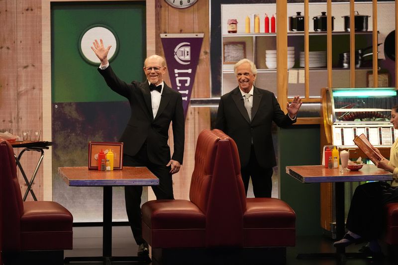 Ron Howard, left, and Henry Winkler present the award for outstanding directing for a comedy series during the 76th Primetime Emmy Awards on Sunday, Sept. 15, 2024, at the Peacock Theater in Los Angeles. (AP Photo/Chris Pizzello)