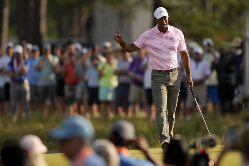 Tiger Woods waves after making a putt on the 10th hole during the first round of the U.S. Open golf tournament Thursday, June 13, 2024, in Pinehurst, N.C. (AP Photo/Matt York)