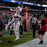 Atlanta Falcons wide receiver Drake London (5) celebrates his touchdown with teammate Chris Lindstrom (63) during the second half of an NFL football game against the Philadelphia Eagles on Monday, Sept. 16, 2024, in Philadelphia. (AP Photo/Matt Rourke)