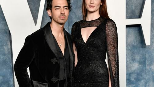 FILE - Joe Jonas, left, and Sophie Turner appear at the Vanity Fair Oscar Party on March 12, 2023, in Beverly Hills, Calif. (Photo by Evan Agostini/Invision/AP, File)