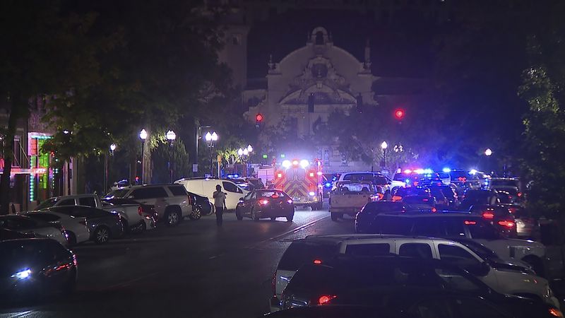 This image provided by WBMA shows police and emergency vehicles in the entertainment district after a shooting in Birmingham, Ala., Sunday, Sept. 22, 2024. (Bill Castle/WBMA via AP)