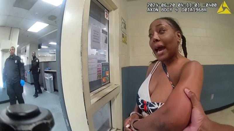 Atlanta police body camera footage shows Douglas County Probate Judge Christina Peterson as she's taken inside a police facility following an altercation at a Buckhead nightclub.