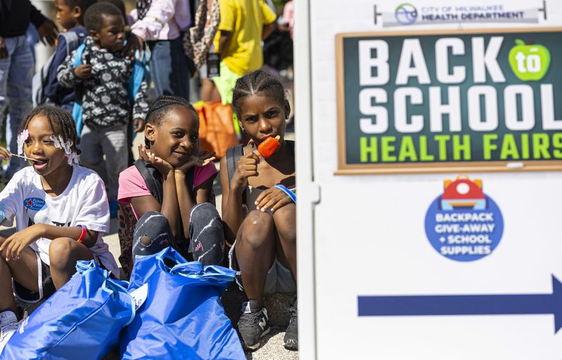 Children attend a back to school health fair in Milwaukee, on Saturday Aug. 10, 2024. (AP Photo/Jeffrey Phelps)