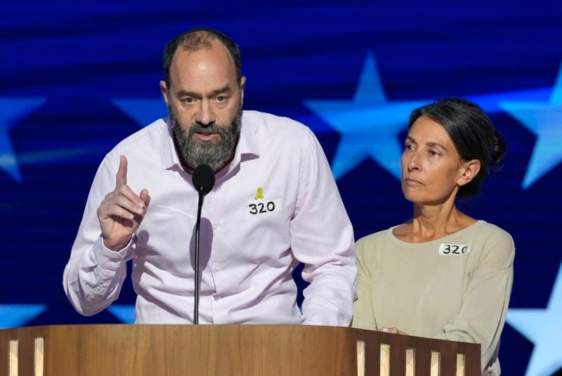 Jon Polin, left, and Rachel Goldberg, parents of Hersh Goldberg-Polin, speak on stage during the Democratic National Convention Wednesday, Aug. 21, 2024, in Chicago. (AP Photo/J. Scott Applewhite)