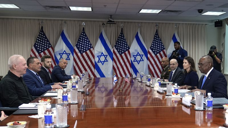 Defense Secretary Lloyd Austin, right, and Israeli Defense Minister Yoav Gallant, second from left, sit down for a meeting at the Pentagon in Washington, Tuesday, June 25, 2024. The two, who have been in weekly contact since the Hamas attack on Israel in October, are expected to discuss Israeli operations in Gaza, humanitarian efforts in the region, and tension with Hezbollah in Lebanon. (AP Photo/Susan Walsh)