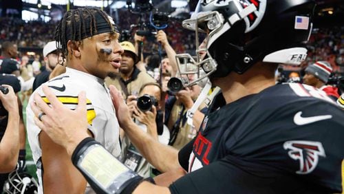 Pittsburgh Steelers quarterback Justin Fields (2) speaks with Atlanta Falcons quarterback Kirk Cousins (18) after the game on Sunday, Sept. 8, at Mercedes-Benz Stadium in Atlanta. The Falcons lost 18-10
(Miguel Martinez/ AJC)