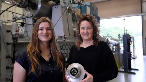 Cindy Taff, right, and Brianna Byrd, left, with Sage Geosystems, a startup that aims to make clean electricity, pose while visiting Southwest Research Institute where testing and research is taking place in San Antonio, Monday, April 1, 2024. (AP Photo/Eric Gay)