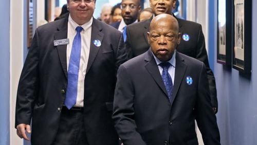 U.S. Rep. John Lewis, front, U.S. Rep. Hank Johnson, center, and Senate Minority Leader Steve Henson prepare for a Democratic Party of Georgia get-out-the-vote effort this weekend. Georgia Democrats hit the road Friday for a final, last-ditch effort to turn out voters as polls show the race between Hillary Clinton and Donald Trump remains close in the state. They gathered for breakfast at the Georgia Democratic Party office in Atlanta, where party leaders laid out their battle plan before splitting up and hitting the road Friday morning. BOB ANDRES /BANDRES@AJC.COM