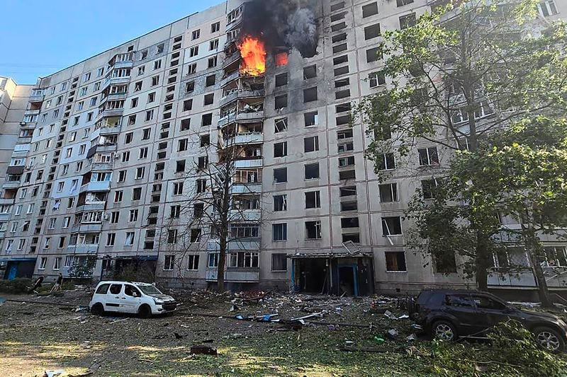 Flames rise and debris is scattered on the ground after a Russian aerial bomb struck a multi-story residential building in Kharkiv, Ukraine, Sunday Sept. 15, 2024. (Ukrainian Presidential Press Office via AP)