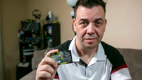 FILE — New York City Police Department officer Mathew Bianchi holds a Police Benevolent Association "courtesy card," in the Staten Island borough of New York, June 2, 2023. (AP Photo/Ted Shaffrey, File)