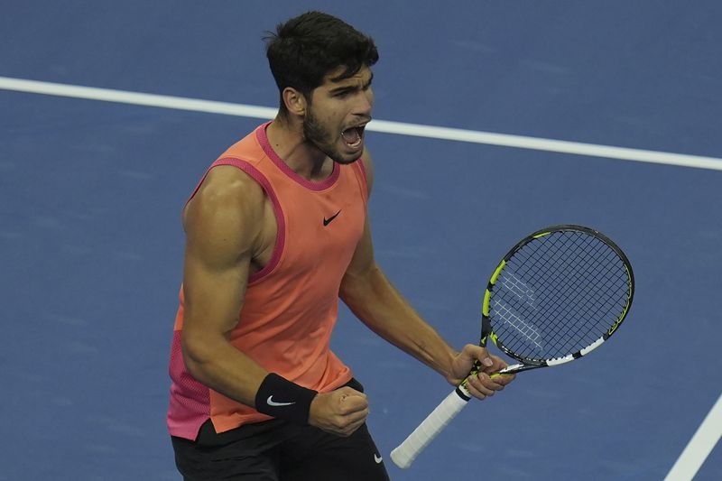 Carlos Alcaraz of Spain reacts after defeating Daniil Medvedev of Russia in a men's singles semi-final match for the China Open tennis tournament held at the National Tennis Center in Beijing, Tuesday, Oct. 1, 2024. (AP Photo/Ng Han Guan)