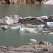 FILE - Chunks of ice float in a lake in front of Rhone Glacier near Goms, Switzerland, June 15, 2023. (AP Photo/Matthias Schrader, File)