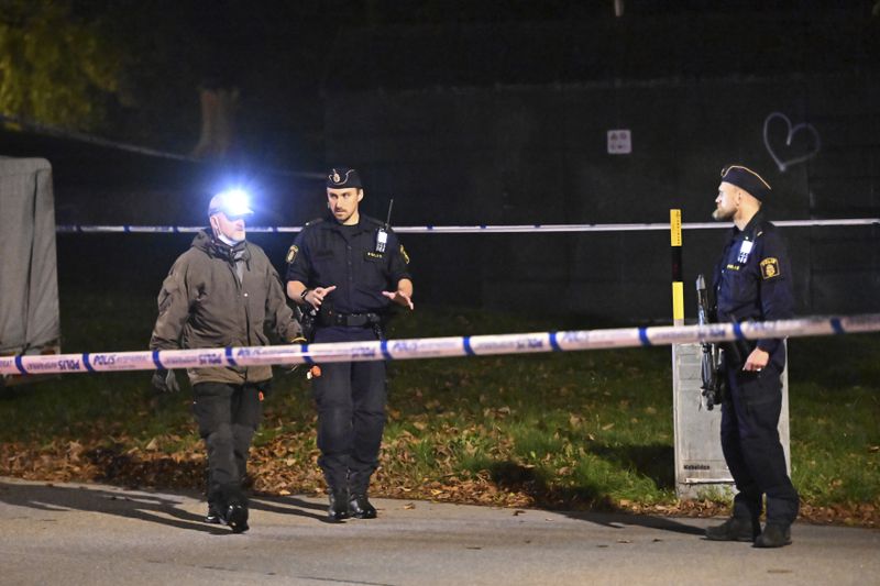 Police guard outside the Israeli embassy in Stockholm, Sweden, Tuesday, Oct. 1, 2024, after a suspected shooting near the embassy. (Anders Wiklund/TT News Agency via AP)