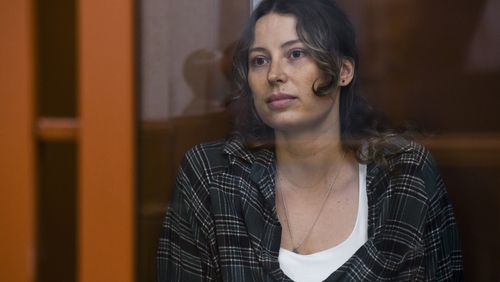 FILE - Ksenia Karelina, also known by the last name of Khavana, sits in a defendant's cage in a court in Yekaterinburg, Russia, on Thursday, June 20, 2024. (AP Photo, File)