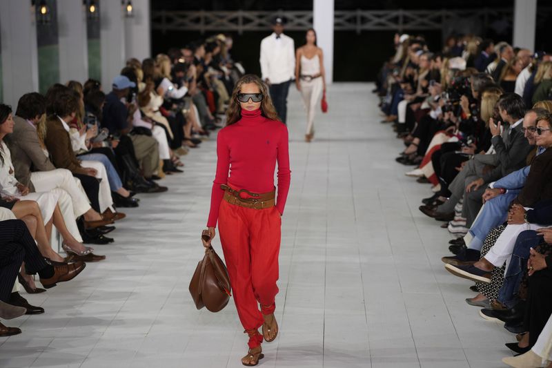 A model walks the runway during the Ralph Lauren Spring/Summer 2025 fashion show as part of New York Fashion Week on Thursday, Sept. 5, 2024, at Khalily Stables in Bridgehampton, N.Y. (Photo by Charles Sykes/Invision/AP)