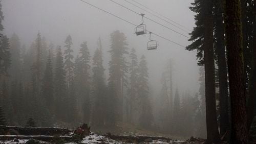 A coating of snow is seen below ski lifts at Sugarbowl Ski Resort Saturday, Aug. 24, 2024, in Donner Summit, Calif. (AP Photo/Brooke Hess-Homeier)