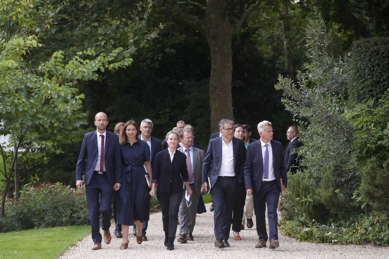 Leftists leaders, from the left, Manuel Bompard, Marine Tondelier, of the Green Party, Lucie Castets, Socialist party secretary general Olivier Faure, second right, and Communist party national secretary Fabien Roussel arrive at the Elysee Palace as French President Emmanuel Macron holds talks with key political players in a bid to form a new government Friday, Aug. 23, 2024 in Paris. (AP Photo/Thibault Camus)