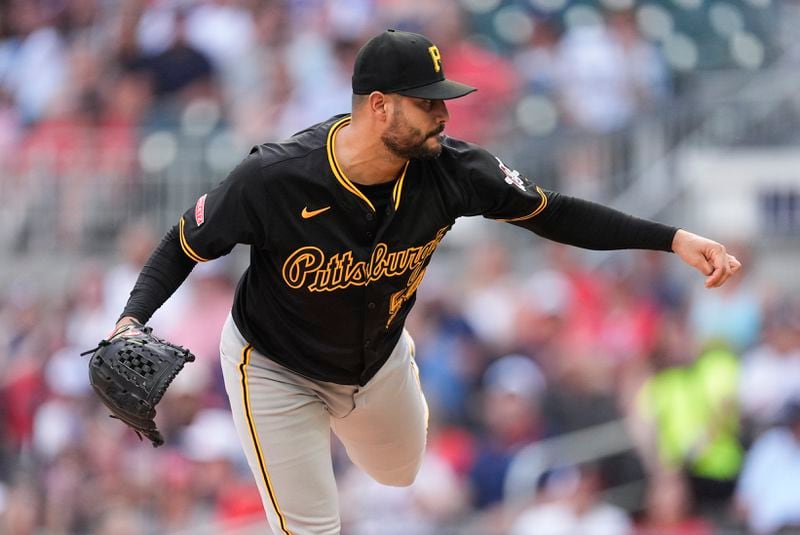 Pittsburgh Pirates stating pitcher Martin Perez delivers in the first inning of a baseball game against the Atlanta Braves Friday, June 28, 2024, in Atlanta. (AP Photo/John Bazemore)