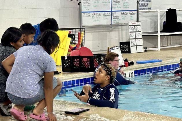 Marcela Cruz-Baltazar and her three kids at the Oakhurst Pool on August 4, 2024. (Photo Courtesy of Daniela Cintron)