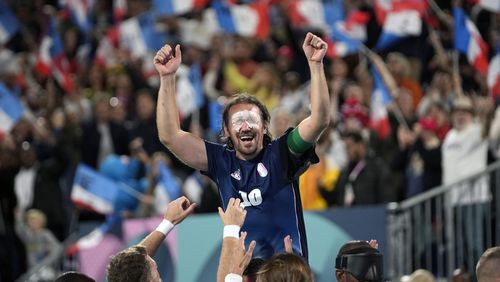 France's captain Frederic Villeroux celebrate after scoring the decisive penalty and winning the blind football gold medal match at the 2024 Paralympics, Saturday, Sept. 7, 2024, in Paris, France. (AP Photo/Christophe Ena)