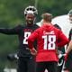 Atlanta Falcons quarterback Kirk Cousins (18) talks with tight end Kyle Pitts (8) during minicamp at the Atlanta Falcons Training Camp, Tuesday, May 14, 2024, in Flowery Branch, Ga. (Jason Getz / AJC)
