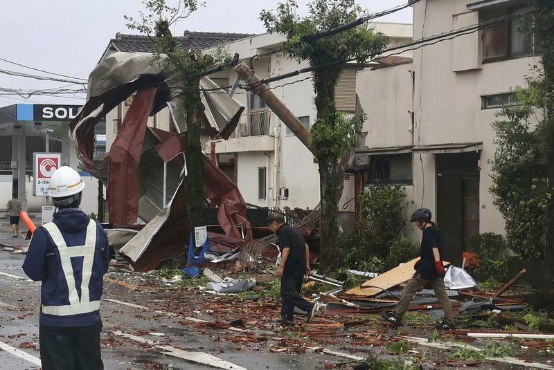 Roof tiles are seen scattered blown away by strong winds of a typhoon in Miyazaki, western Japan, Thursday, Aug. 29, 2024. (Kyodo News via AP)