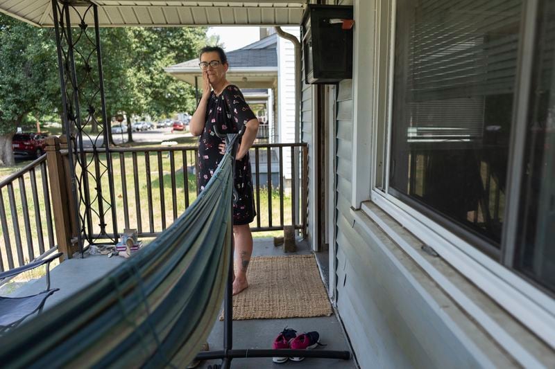 Amanda Bailey, 35, stands on her front porch on Friday, June 21, 2024, in Middletown, Ohio. This house, where Bailey and her family live, is the same house where “Hillbilly Elegy” author Sen. J.D. Vance, R-Ohio, grew up. Bailey said she thought “Hillbilly Elegy” nailed it, and that former President Donald Trump and Vance would “make a great team.” (AP Photo/Carolyn Kaster)