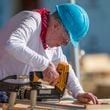 FILE- In this Aug. 27, 2018 file photo, former President Jimmy Carter works with other volunteers on site during the first day of the weeklong Jimmy & Rosalynn Carter Work Project, their 35th work project with Habitat for Humanity, in Mishawaka, Ind. Carter turns 95 on Tuesday, Oct. 1, 2019. (Robert Franklin/South Bend Tribune via AP, File)