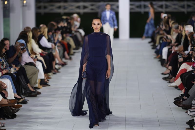 A model walks the runway during the Ralph Lauren Spring/Summer 2025 fashion show as part of New York Fashion Week on Thursday, Sept. 5, 2024, at Khalily Stables in Bridgehampton, N.Y. (Photo by Charles Sykes/Invision/AP)