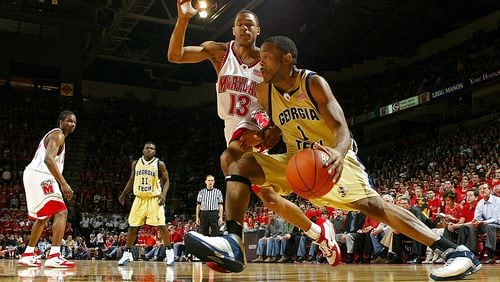 COLLEGE PARK, MD - FEBRUARY 19:  B.J. Elder #1 of the Georgia Tech Yellow Jackets drives the baseline around Chris McCray #13 of the Maryland Terrapins during ACC basketball action on February, 2004 at the Comcast Center in College Park, Maryland.  (Photo by Doug Pensinger/Getty Images)