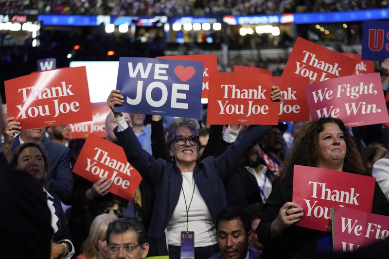 Delegates cheer as President Joe Biden speaks during the Democratic National Convention Monday, Aug. 19, 2024, in Chicago. (AP Photo/Paul Sancya)