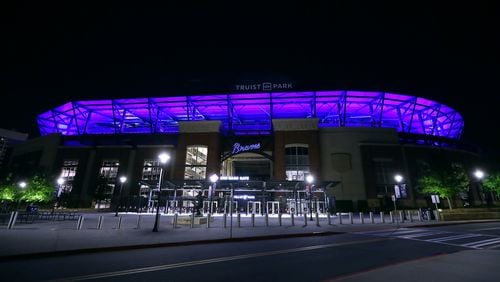 The Atlanta Braves Truist Park is transformed to blue as part of an initiative to salute essential workers on the frontlines of the coronavirus pandemic on Thursday, April 9, 2020, in Atlanta. The Light It Blue event includes more than 150 major sports and entertainment venues and historic landmarks and buildings across the United States.  Curtis Compton ccompton@ajc.com