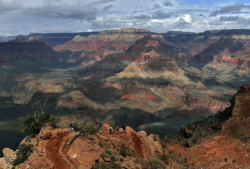 FILE - In this Feb. 22, 2005, file photo, with the North Rim in the background, tourists hike along the South Rim of the Grand Canyon in Grand Canyon, Ariz. (AP Photo/Rick Hossman, File)