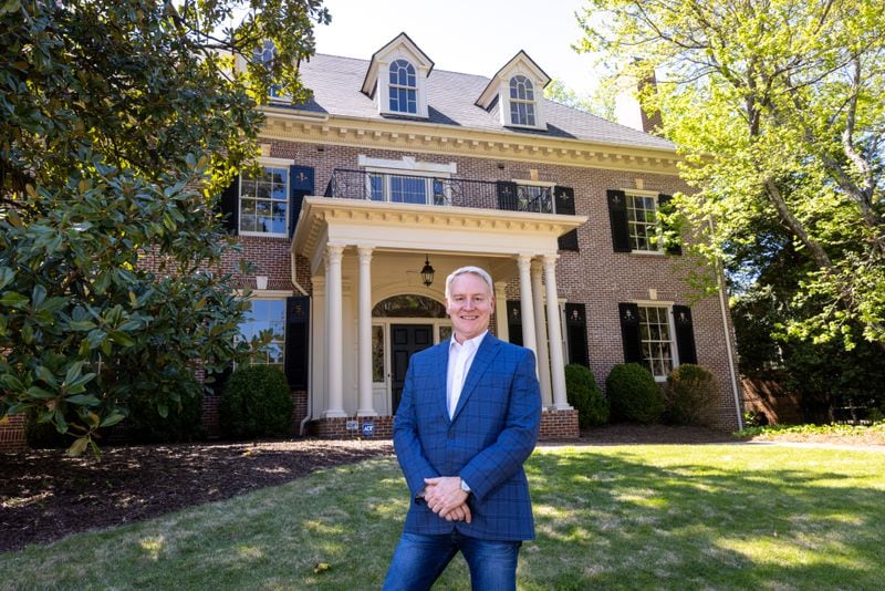 The three-story, 8,000-square-foot Randolph-Lucas-Jones house was gently moved to a new location in Ansley Park by crossing from Peachtree Street through the interior of the block, leaving the plantings in the front yard, including an 80-year-old magnolia and a Japanese maple, undisturbed.  (Arvin Temkar / arvin.temkar@ajc.com)