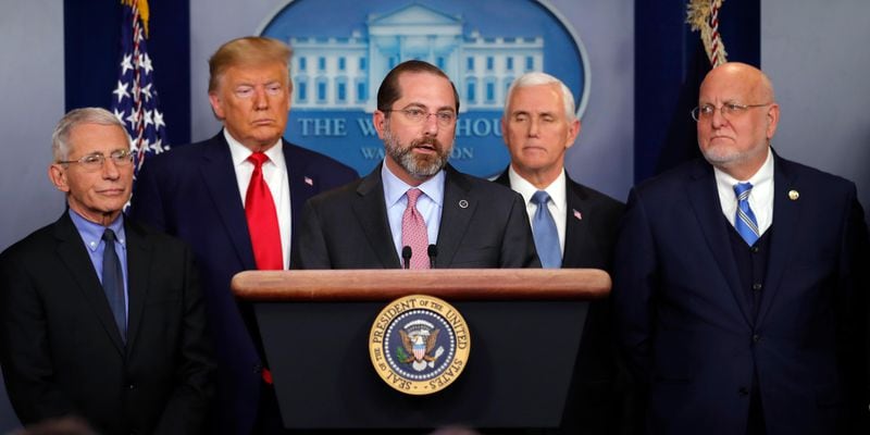 Health and Human Services Secretary Alex Azar speaks as National Institute for Allergy and Infectious Diseases Director Dr. Anthony Fauci, President Donald Trump, Vice President Mike Pence and Robert Redfield, director of the CDC listen, during a briefing about the coronavirus.