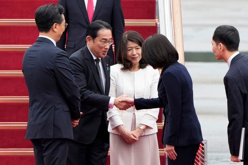 Japanese Prime Minister Fumio Kishida, second from left, is greeted as his wife Yuko Kishida stands upon their arrival at Seoul airbase in Seongnam, South Korea, Friday, Sept. 6, 2024. (AP Photo/Ahn Young-joon)