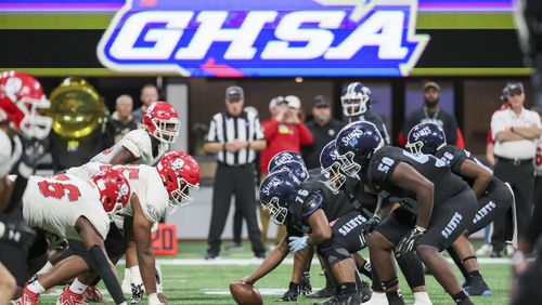 Cedar Grove center Javon Braden (76) prepares to snap the ball before an offensive play against Savannah Christian in the Class 3A GHSA State Championship game at Mercedes-Benz Stadium, Wednesday, December. 13, 2023, in Atlanta. (Jason Getz / Jason.Getz@ajc.com)