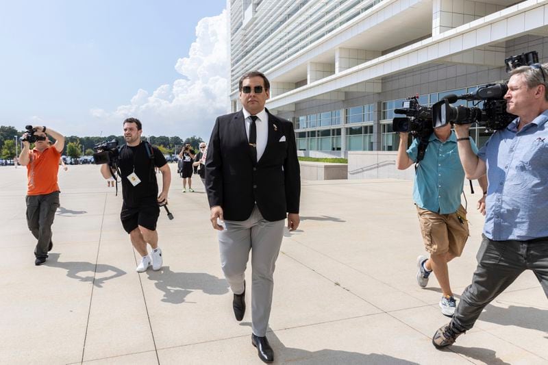 Former U.S. Rep. George Santos arrives at court in Central Islip, N.Y., Monday, Aug. 19, 2024. (AP Photo/Stefan Jeremiah)