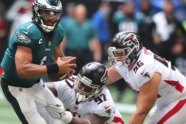 091221 Atlanta: Atlanta Falcons defensive lineman Grady Jarrett (center) and Tyler Davison look to tackle Philadelphia Eagles quarterback Jalen Hurts during the second half in a NFL football game on Sunday, Sept 12, 2021, in Atlanta.    ���Curtis Compton / Curtis.Compton@ajc.com���