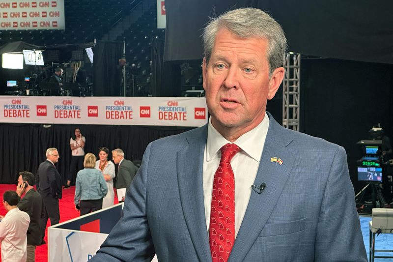 FILE - Georgia Gov. Brian Kemp speaks in the spin room before a presidential debate between President Joe Biden and Republican presidential candidate former President Donald Trump in Atlanta, June 27, 2024. (AP Photo/Nathan Ellgren, File)